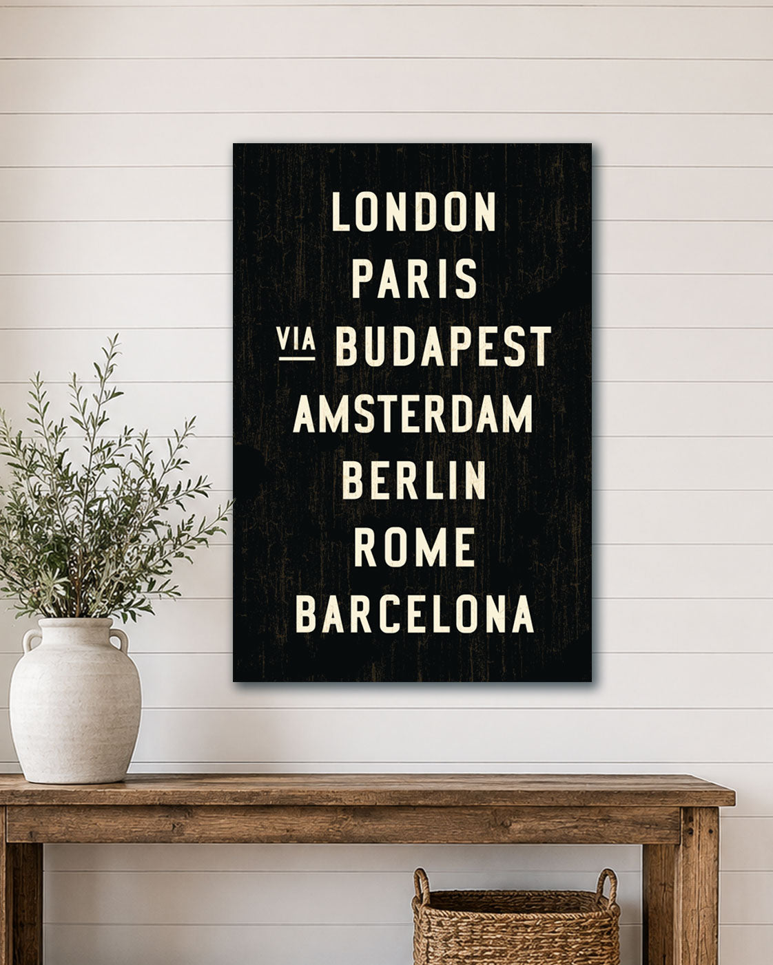 European Transit Sign Canvas Wall Art hanging above a wooden table against a white wall