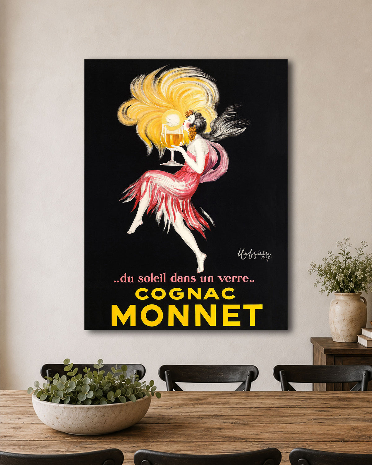 Cognac Monnet Poster by Cappiello hanging in a dining room
