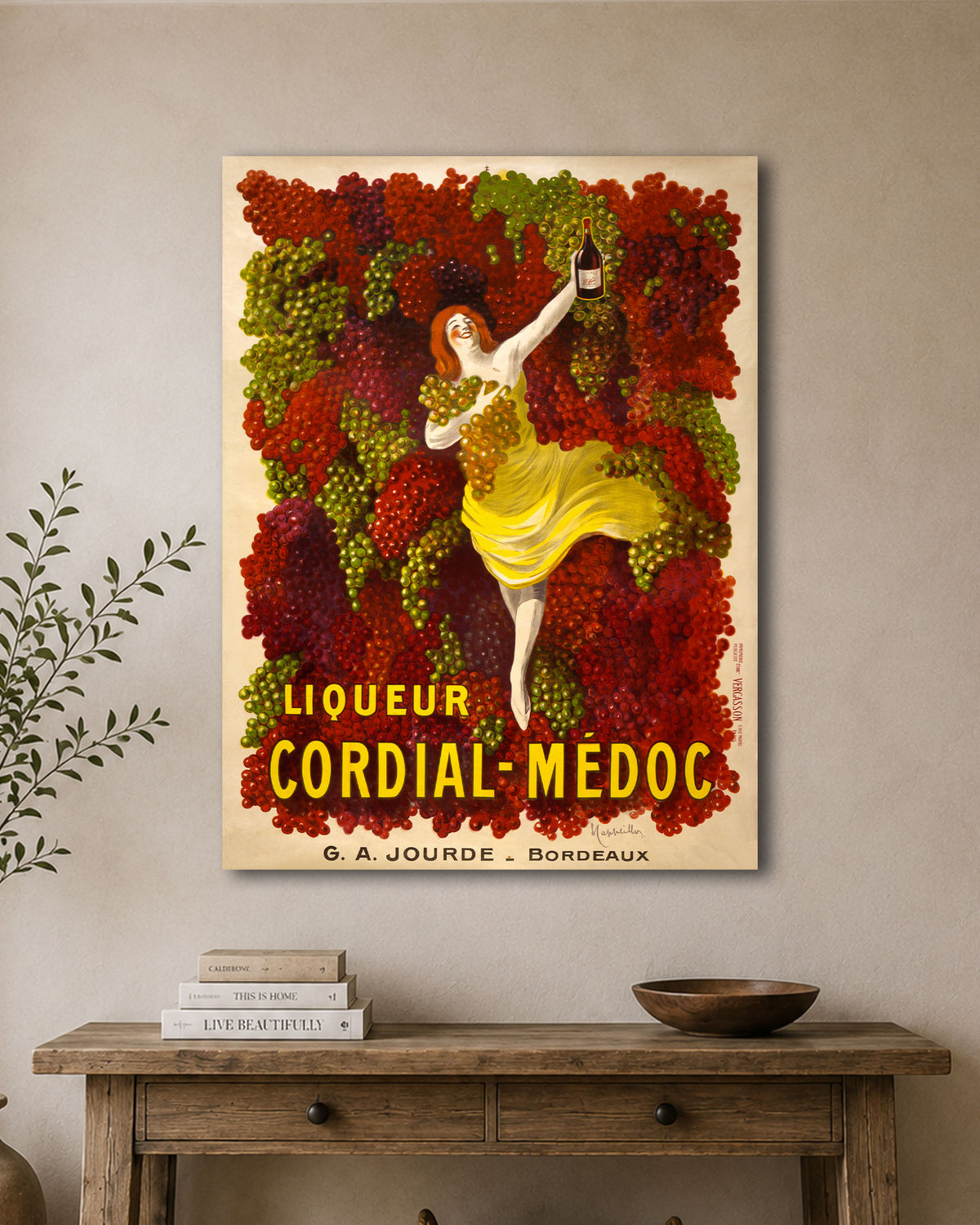 Cordial Medoc Poster Art by Leonetto Cappiello hanging above a console table