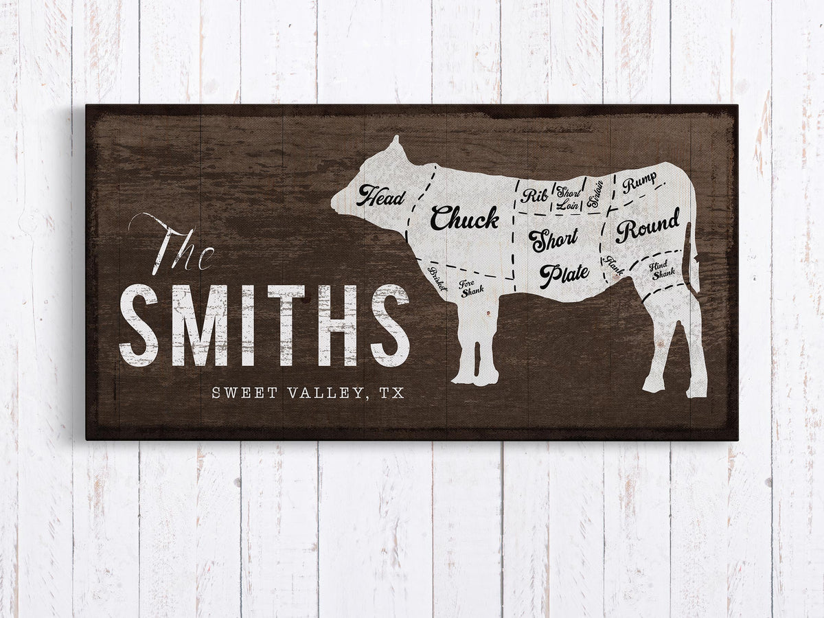 Personalized Family Name Sign with Cow in brown hanging on wood wall