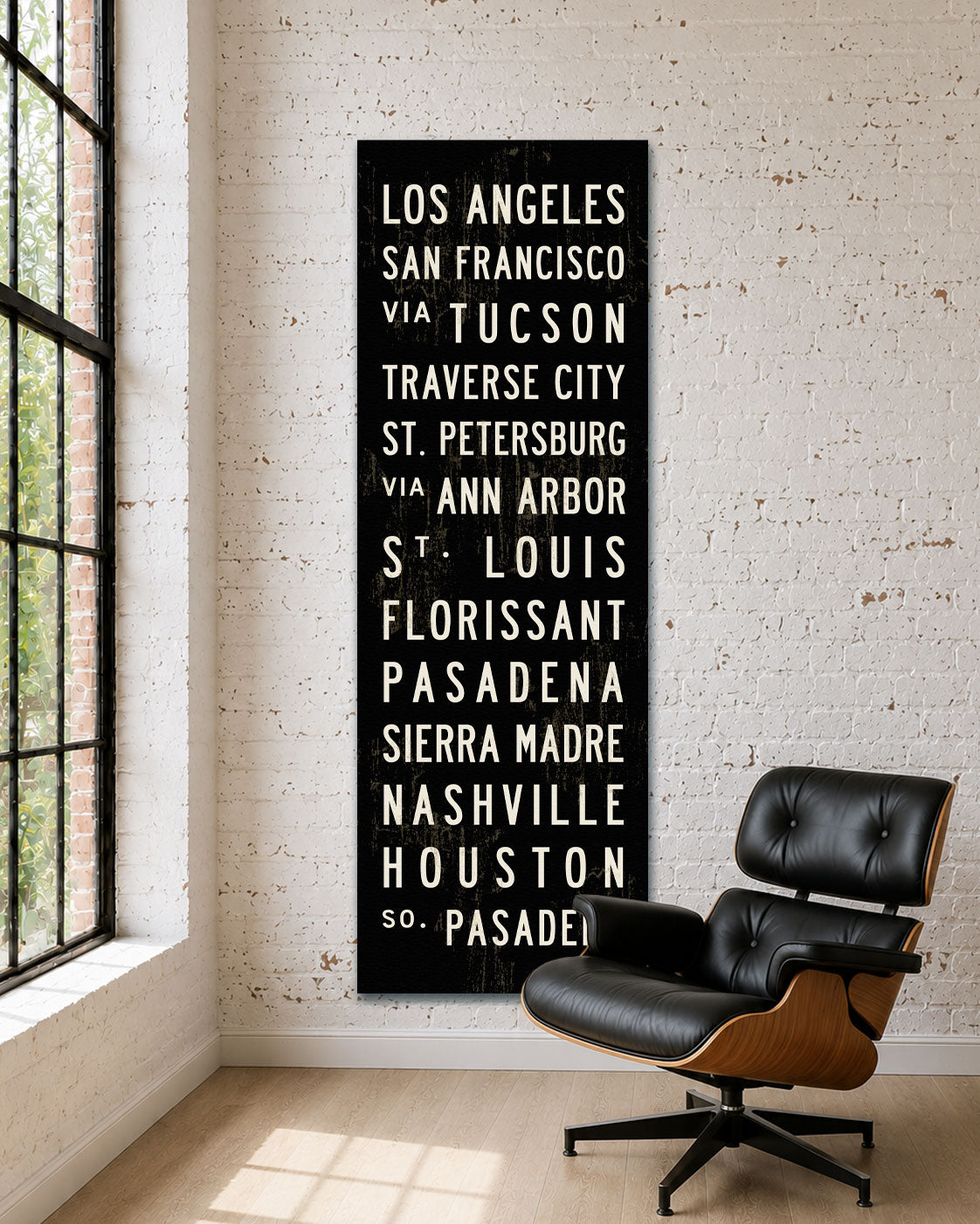 Custom Subway Sign Art hanging in a room with an Eames chair.