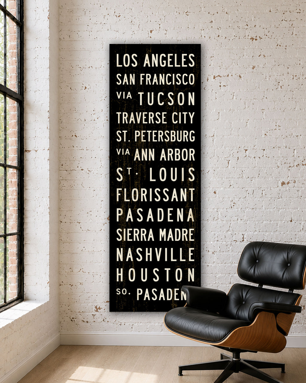 Custom Subway Sign Art hanging in a room with an Eames chair.