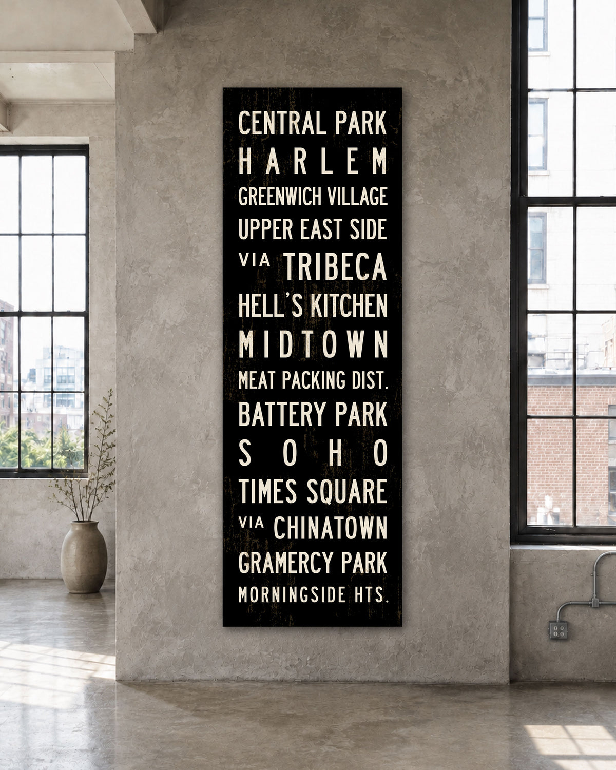 New York Subway Sign Art on stretched canvas hanging on wall in a loft