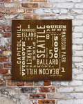 Seattle City Art Canvas hanging on a brick wall, Seattle Word Art