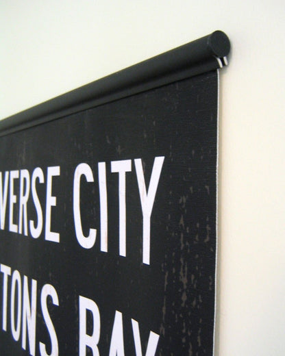 The 20-inch Poster Hanger displaying a subway sign from Transit Design